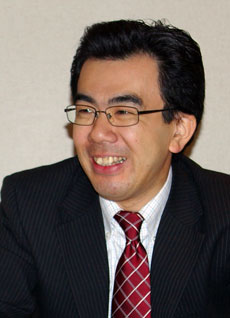 越塚登氏
