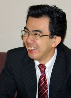 越塚登氏